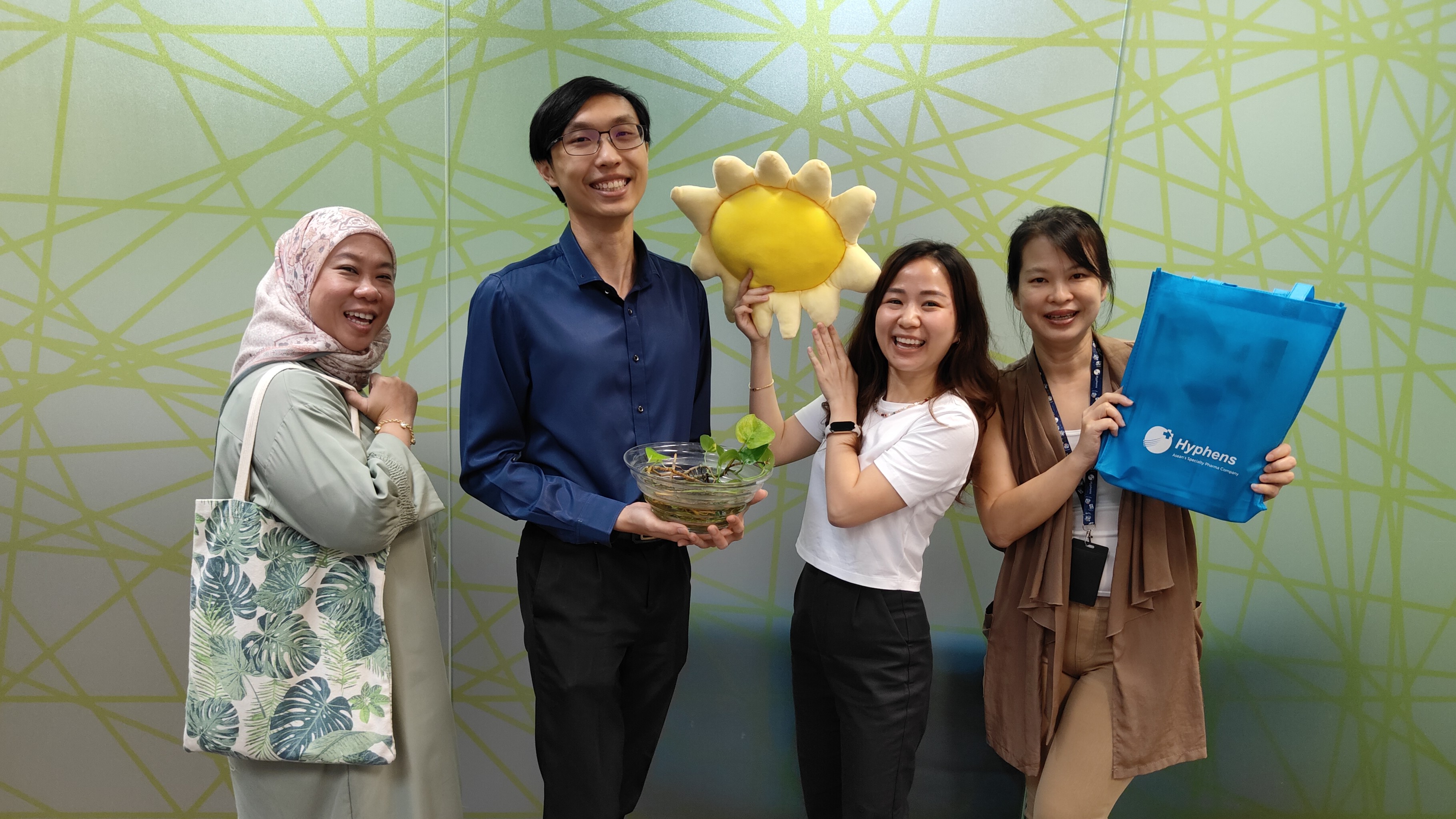 DocMed team members celebrating a sustainability initiative